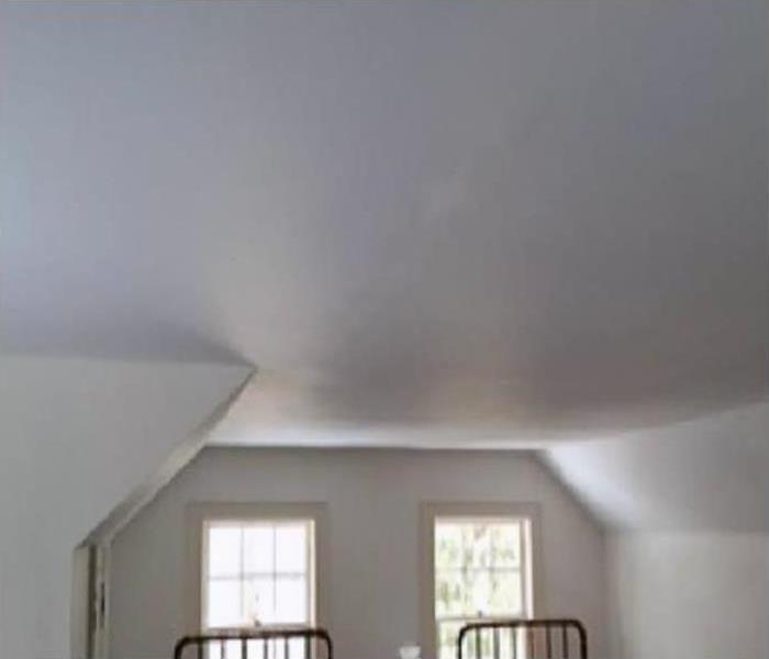 repaired ceiling after water damage restoration
