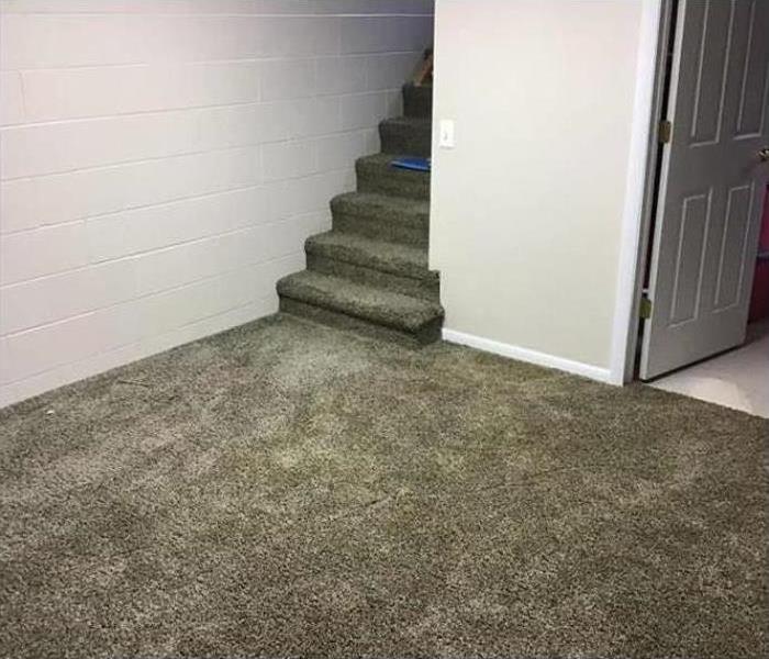 clean grey carpet at entrance of a home