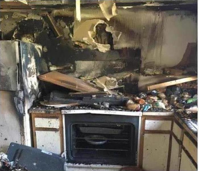 kitchen burned with soot and collapsed cabinetry