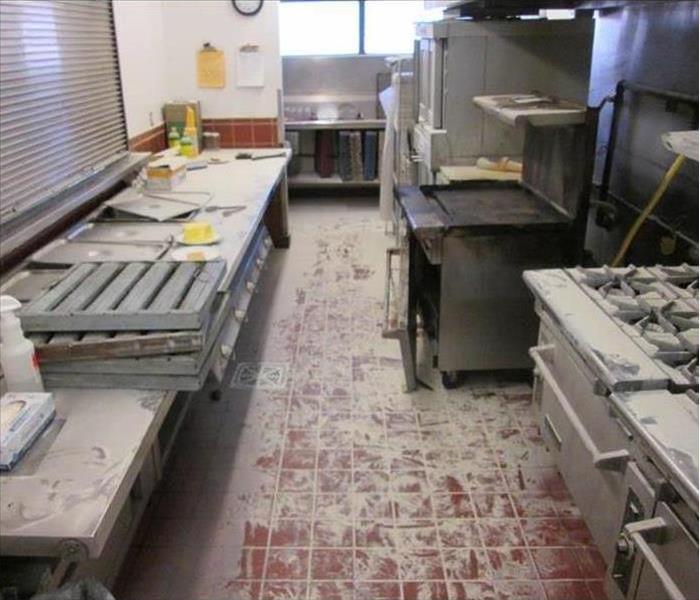 restaurant fire aftermath in a kitchen before cleaning