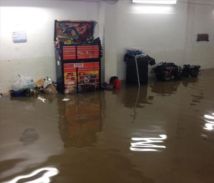 garage with workshop heavily flooded