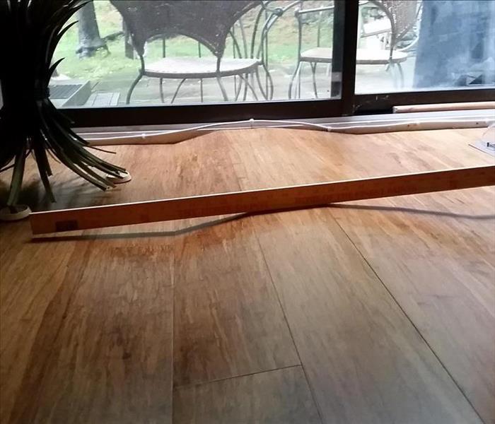 warped hardwood floor from water damage
